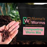 Hand holding composting worms with a bag labeled 'Meme's Worms' in the background.