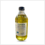 Bottle of castor oil with a label on a white background