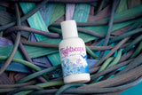 Bottle of Nightscape product on a woven mat with blue and green tones