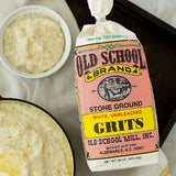 Bag of Old School Brand stone ground grits with bowls of grits on a table.