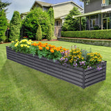 Raised garden bed with flowers in a backyard setting