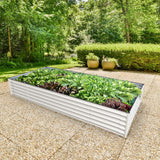 Raised garden bed with plants in a garden setting