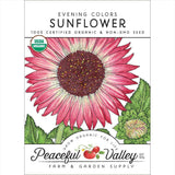 Peaceful Valley Farm & Garden Supply sunflower seed packet with a pink sunflower illustration.