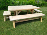 Wooden picnic table with benches on a grassy area