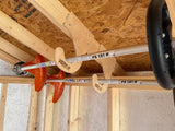 Wooden beams with a tool labeled 'FS 131 R' on a construction site.