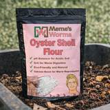 Package of Meme's Worms Oyster Shell Flour with a pink label on a background of soil.