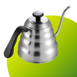 Stainless steel kettle with a long spout on a green background