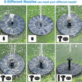 Solar water fountain with six different nozzles on a grass background