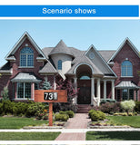 Large brick house with a wooden address sign displaying '731'.
