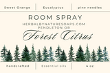 Room spray label with tree design and product details on a white background