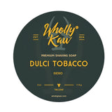 Round label for Wholly Kaw Dulci Tobacco shaving soap with yellow text on a black background