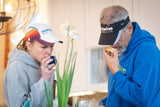 Two people wearing visors and hoodies, smelling OLD FASHIONED MEN'S SHAVE SOAP