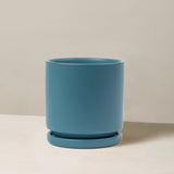 Blue plant pot on a beige background