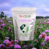 Package of Tri-Color Clover Mix from Earthwise Seed Company in a field of clover.
