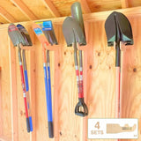 Set of shovels hanging on a wooden wall with a visible brand logo.