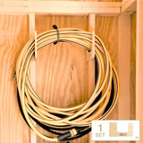 Coiled extension cord with a label on a wooden background