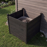 Outdoor air conditioning unit covered by a wooden enclosure in a garden setting.