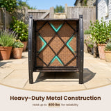 A heavy-duty outdoor patio table frame shown from the back in a backyard setting, featuring a dark brown wicker back panel with a black diamond metal support structure and bright teal accent lines. Text at the bottom reads 'Heavy-Duty Metal Construction Hold up to 400 lbs for reliability'.