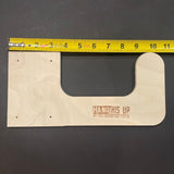 Wooden tool holder with a clear window and 'Hang It Up' branding, measured against a yellow tape measure on a dark background.
