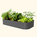 Gray metal raised garden bed with plants on a beige background