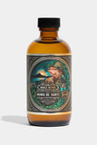 Bottle of Noble Otter Monoi de Tahiti aftershave with decorative label on a white background
