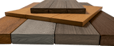 Stack of wooden planks in various colors on a clear background