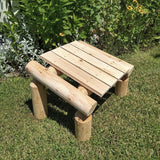 Outdoor Patio Footrest set on grass with plants in the background